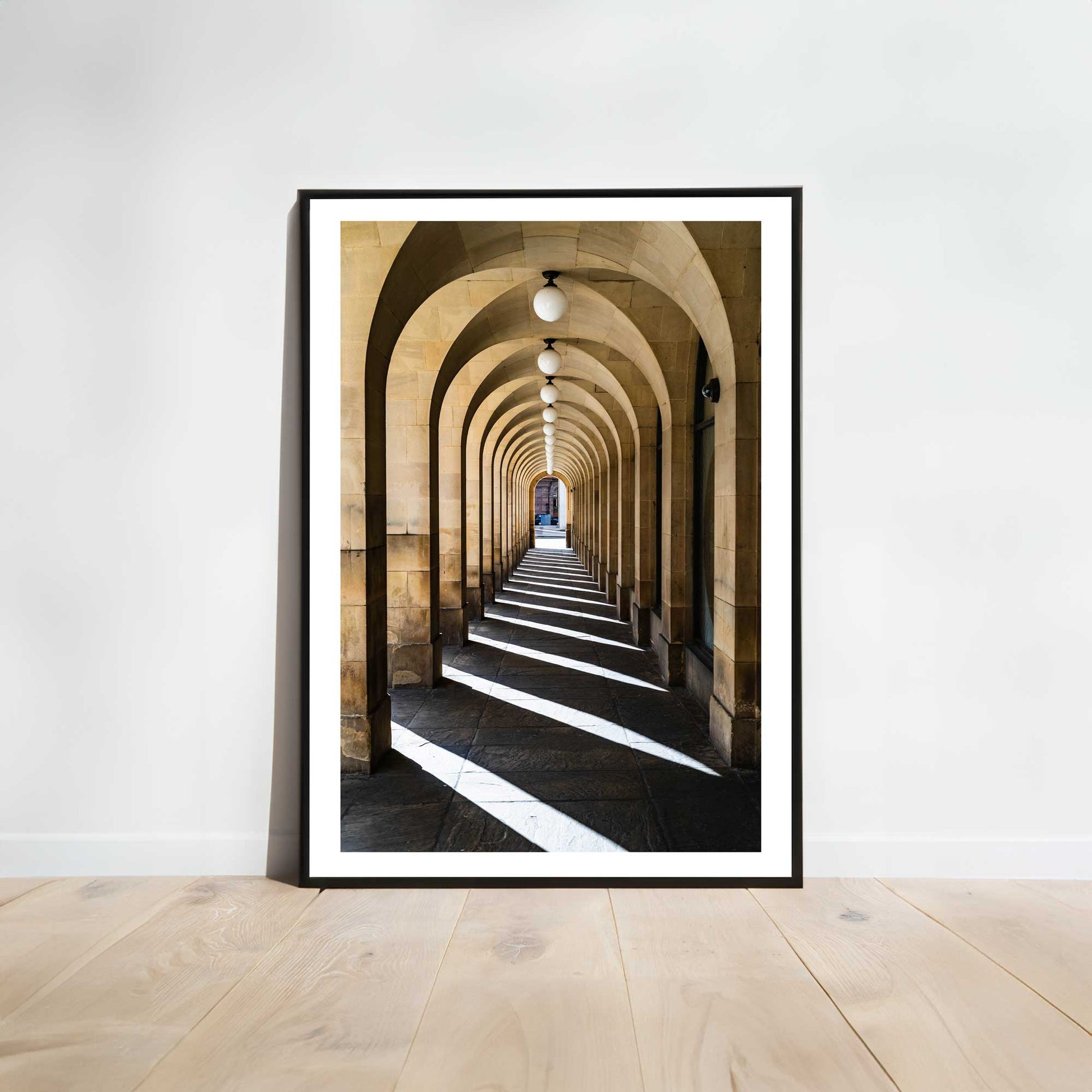 This is a photographic print of the archways at Manchester Town Hall.