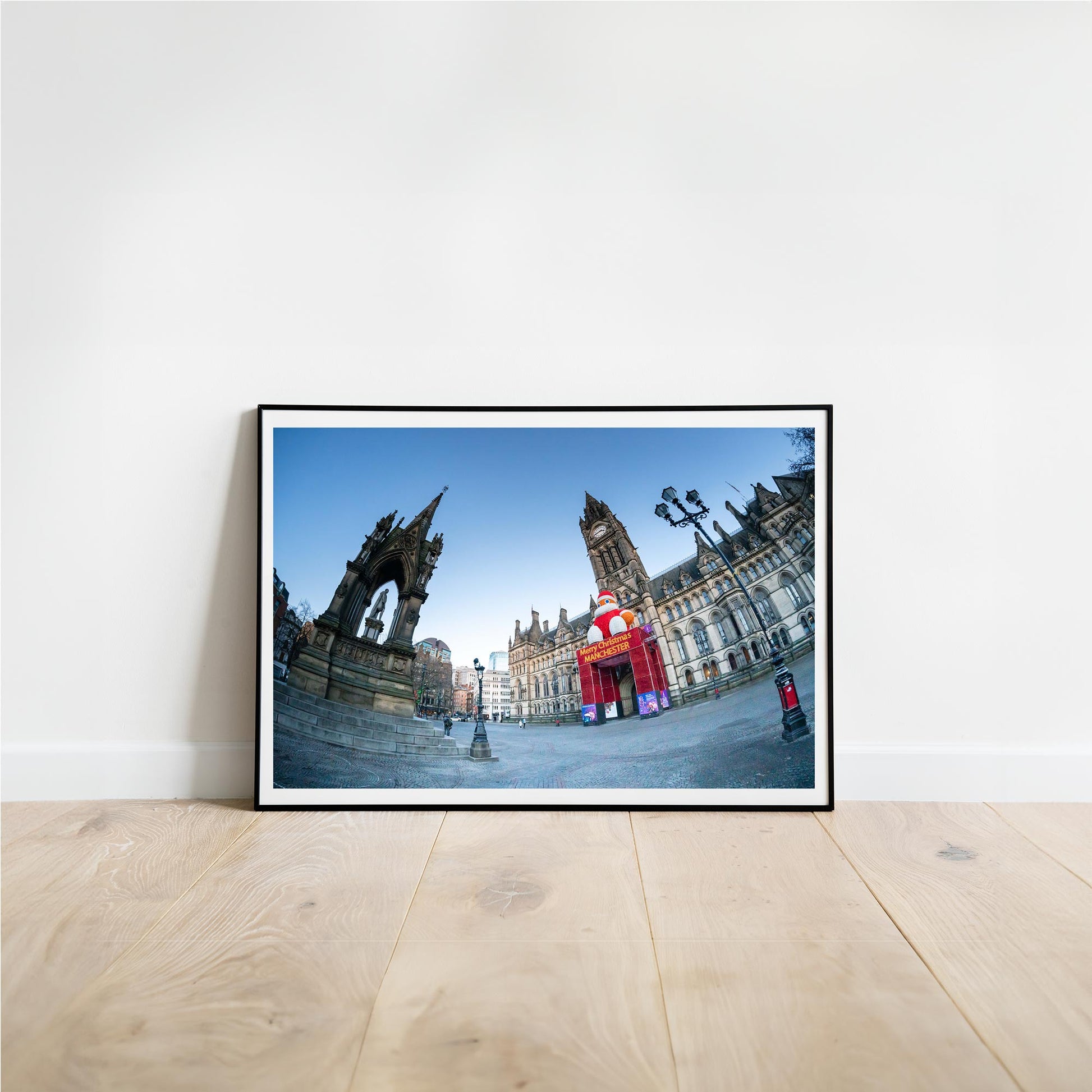 This is a photographic print of the Manchester Town Hall.