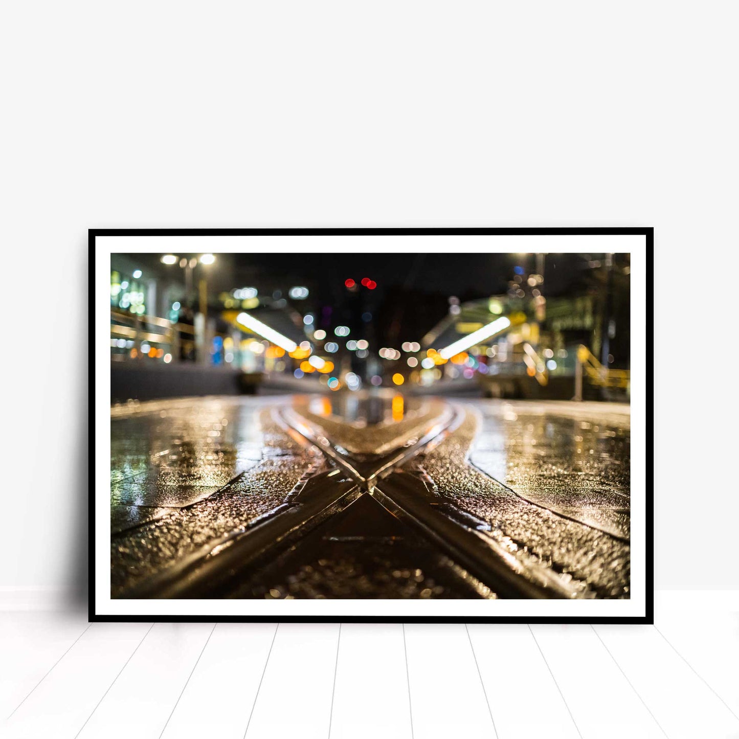 Photographic print of Manchester Tramlines at night showing a soft-focused background, taken in Manchester, England, UK.