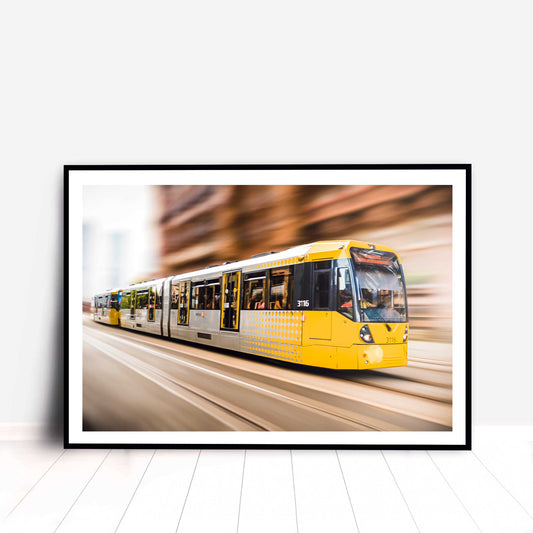 Photographic print of Manchester Tram with motion blur effect making the tram look like it is speeding, taken in Manchester, England, UK.