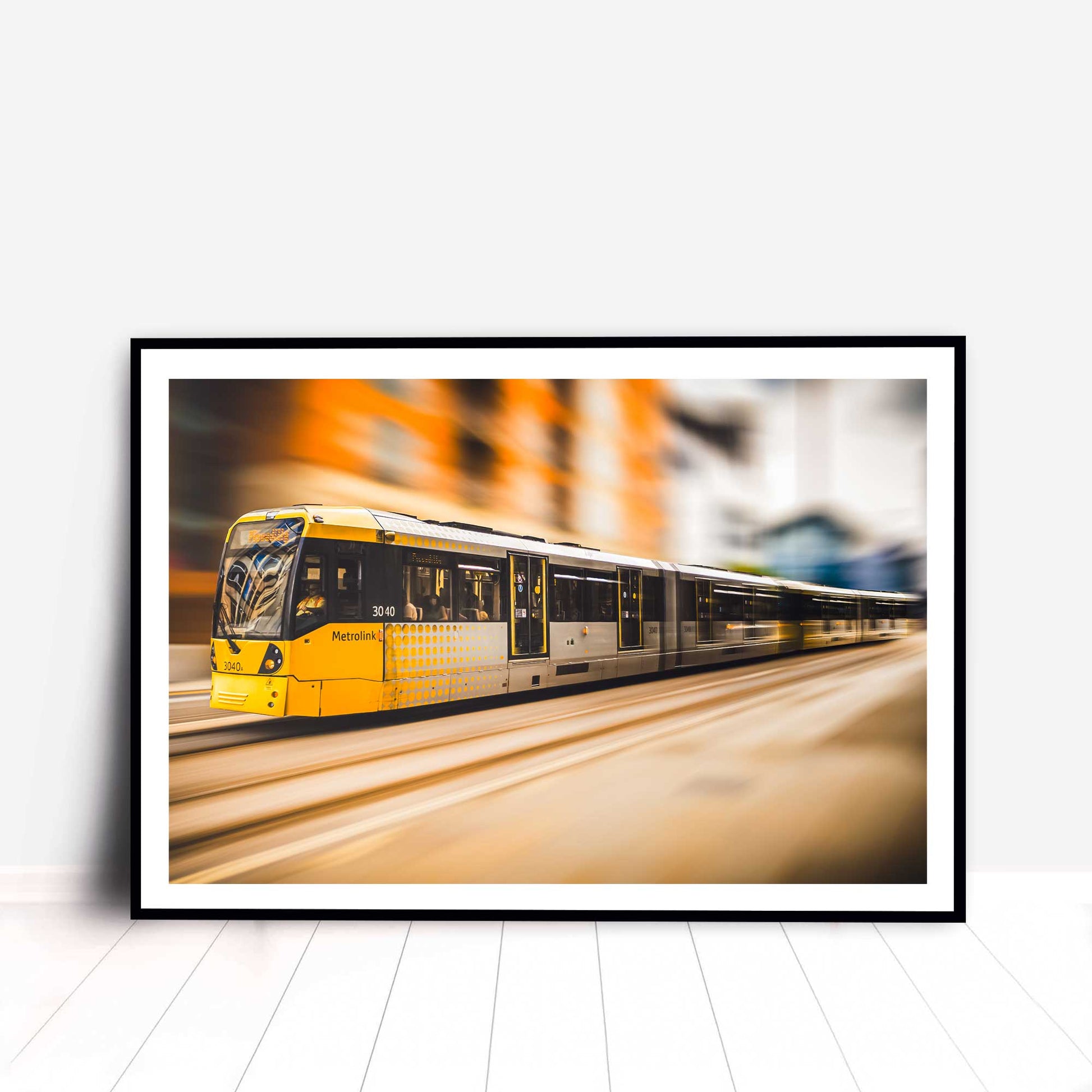 Photographic print of Manchester Tram with motion blur effect making the tram look like it is speeding, taken in Manchester, England, UK.
