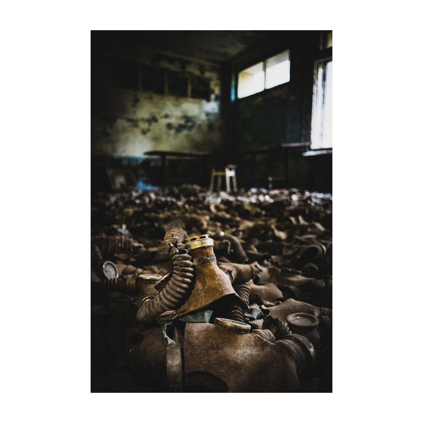Richard Abram Photography - Photographic print of urbex photography taken in Pripyat, Chernobyl, Ukraine.
Image shows gas masks covering the floor.