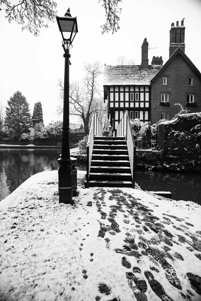 Photography by Richard Abram - Black and White Winter Photo of a Bridge with a Tudor building from Manchester (alphabet bridge in Worsley along Worsley canal)