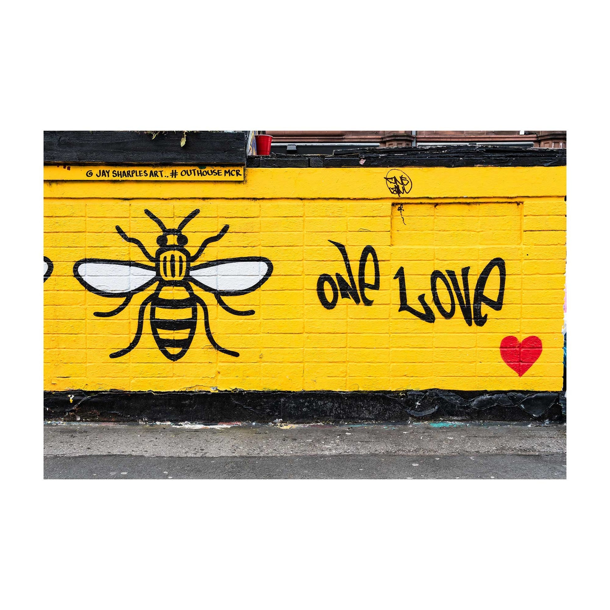 Richard Abram Photography - Photographic print of One Love Manchester Bee Mural Street Photograph, taken in Manchester, England, UK.