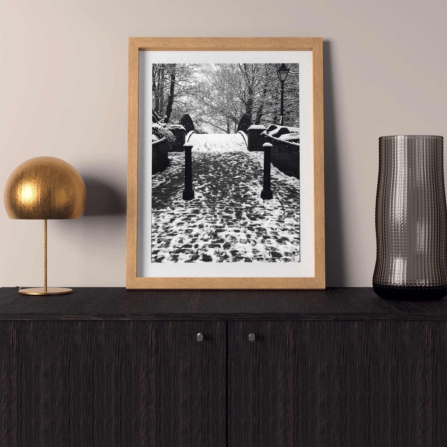 Richard Abram Photography - The photographic scenic print was taken on the Worsley canal in Greater Manchester. Taken on a wintery morning day. The image shows a snow scene with the cast-iron footbridge covered in winter snowy footprints.
