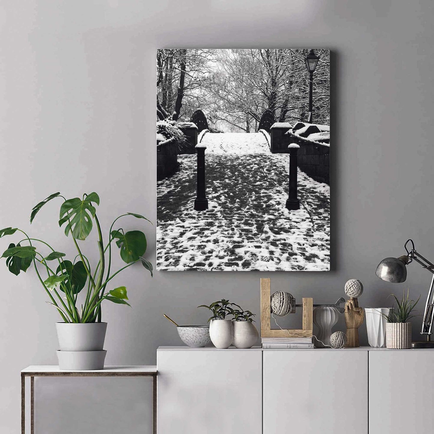 Richard Abram Photography - The photographic scenic print was taken on the Worsley canal in Greater Manchester. Taken on a wintery morning day. The image shows a snow scene with the cast-iron footbridge covered in winter snowy footprints.