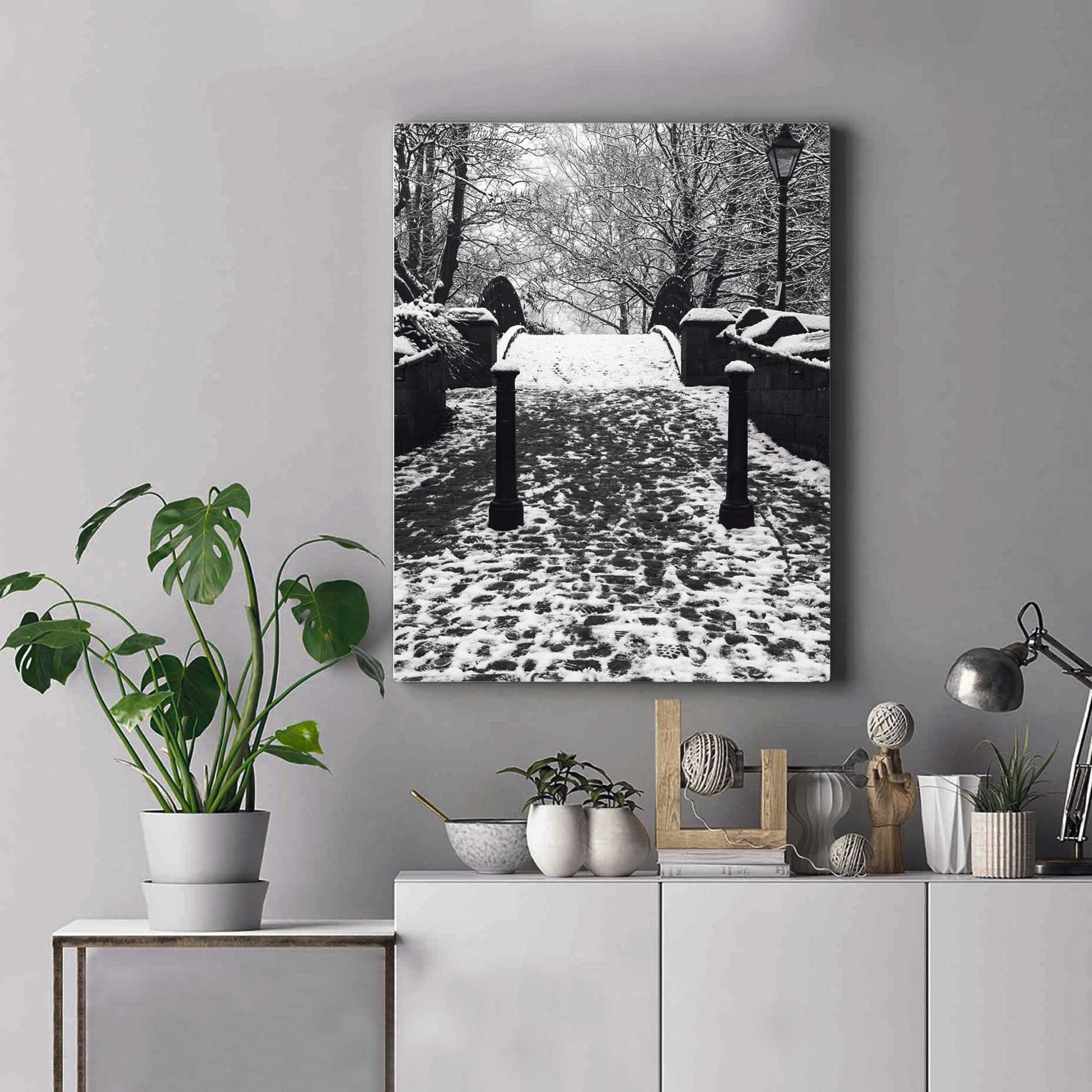 Richard Abram Photography - The photographic scenic print was taken on the Worsley canal in Greater Manchester. Taken on a wintery morning day. The image shows a snow scene with the cast-iron footbridge covered in winter snowy footprints.