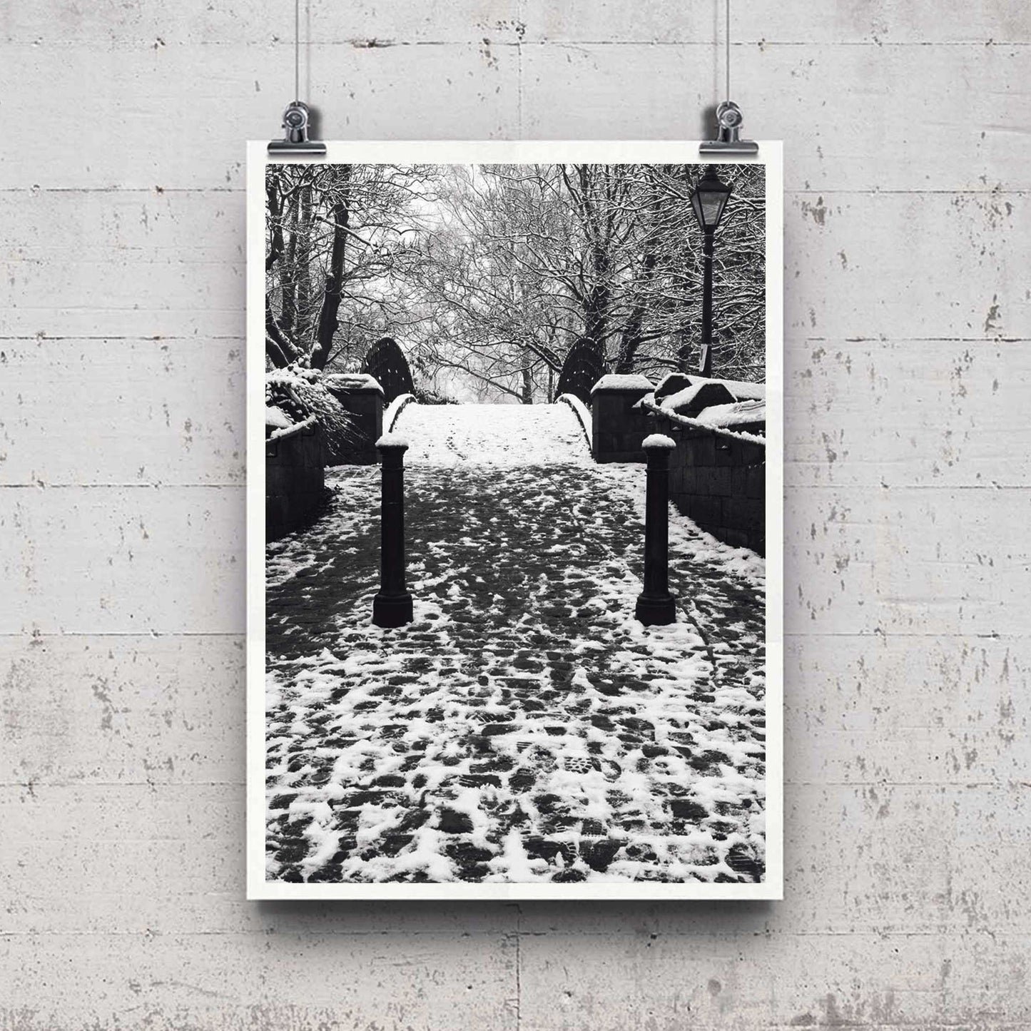 Richard Abram Photography - The photographic scenic print was taken on the Worsley canal in Greater Manchester. Taken on a wintery morning day. The image shows a snow scene with the cast-iron footbridge covered in winter snowy footprints.
