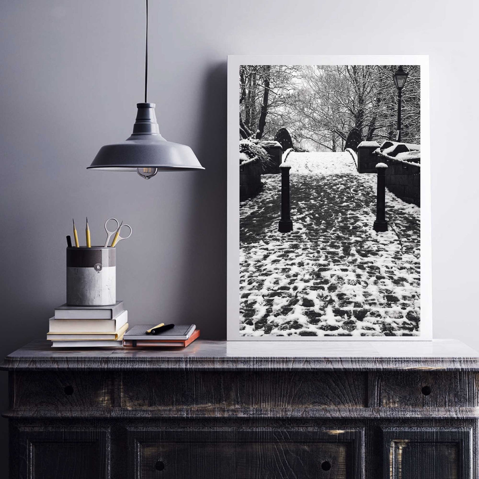 Richard Abram Photography - The photographic scenic print was taken on the Worsley canal in Greater Manchester. Taken on a wintery morning day. The image shows a snow scene with the cast-iron footbridge covered in winter snowy footprints.