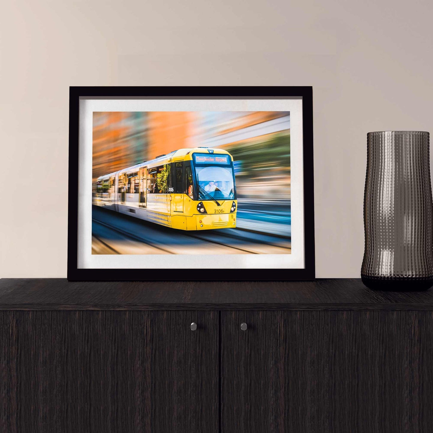 Richard Abram Photography - Photographic print of Manchester Tram with motion blur effect making the tram look like it is speeding, taken in Manchester, England, UK.