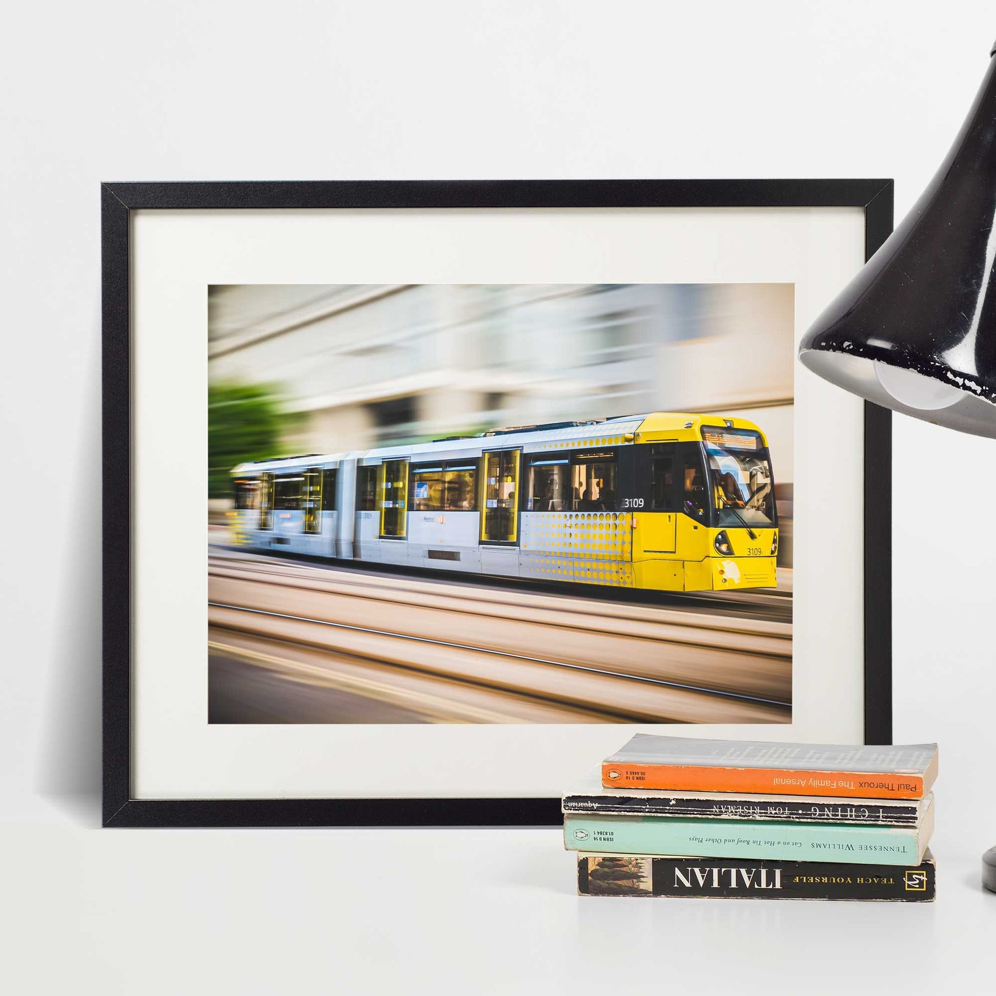 Richard Abram Photography - Photographic print of Manchester Tram with motion blur effect making the tram look like it is speeding, taken in Manchester, England, UK.