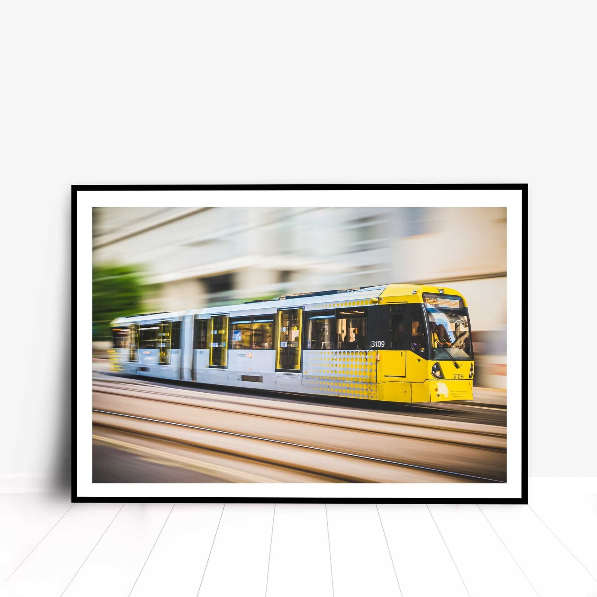 Richard Abram Photography - Photographic print of Manchester Tram with motion blur effect making the tram look like it is speeding, taken in Manchester, England, UK.