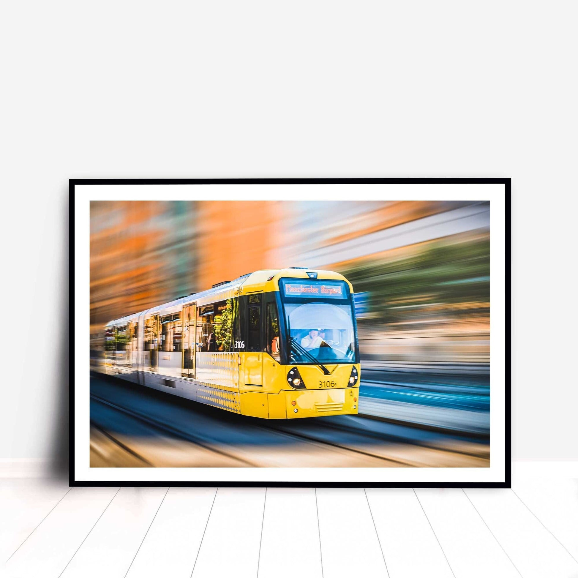Richard Abram Photography - Photographic print of Manchester Tram with motion blur effect making the tram look like it is speeding, taken in Manchester, England, UK.