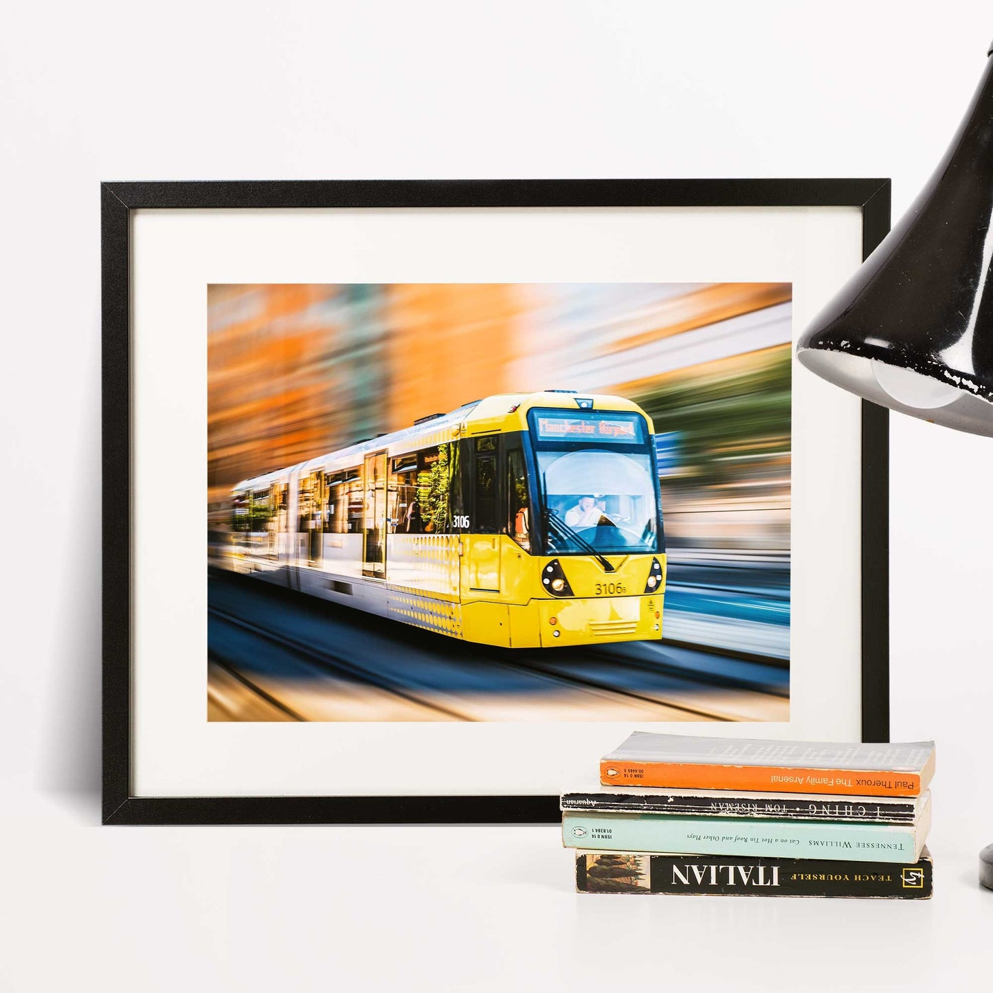 Richard Abram Photography - Photographic print of Manchester Tram with motion blur effect making the tram look like it is speeding, taken in Manchester, England, UK.