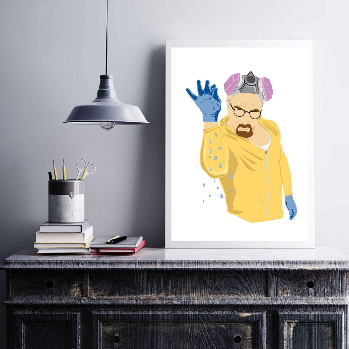 Richard Abram Illustration of Walter white from Breaking Bad in the style of Salt Bae, wearing a yellow jump suit sprinkling blue crystals. Illustration Digital Print, Wall Art, Minimalist. Displayed in a picture frame with objects around.